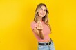© Roquillo - Young beautiful woman wearing striped t-shirt over yellow background inviting to come with hand. Happy that you came