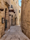 Fototapeta Uliczki - narrow street in the town of Medina, Malta