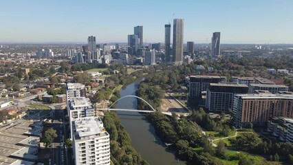 Wall Mural - Aerial drone view of Parramatta CBD above Parramatta River in Greater Western Sydney, NSW, Australia showing development of the city as at June 2023