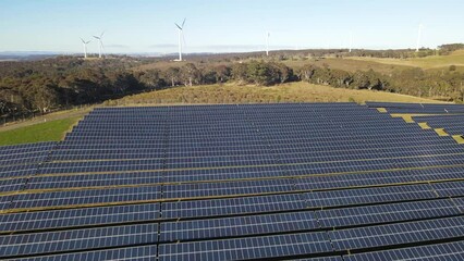 Wall Mural - aerial drone view of a hybrid wind and solar farm for renewable clean energy supply located at banni