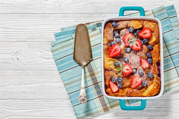 Wall Mural - Sweet Croissant Casserole with Berries in dish