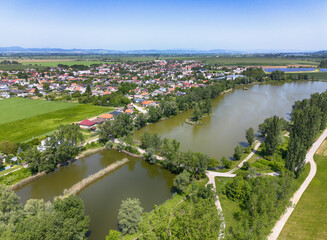 Canvas Print - Lake and village in Slovakia, aerial view