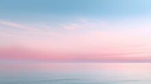 Clear Blue Sky Sunset With Glowing Pink And Purple Horizon On Calm Ocean Seascape Background. Picturesque