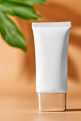 Closed plastic white tube of skin care cream. Copy space. Showcase.