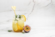 passionfruit cocktail. Tropical drink for summer party. on a light background, refreshing drink or beverage with ice, place for text