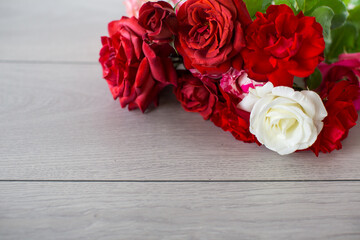 Wall Mural - Floral background of pink, red and other roses