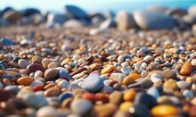  A Close Up Of A Bunch Of Rocks On A Beach With A Sky Background And A Blurry Image Of Rocks On The Ground With A Blue Sky In The Background.  Generative Ai