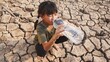 Rural girl with sitting drinking clean water on dry ground. Concept drought and crisis environment..