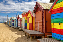 Brighton Beach Victorian Bathing Boxes. Brightly Painted Colourful Beach Huts Line The Sand In Melbourne, Australia. They Are Highly Desirable And Extremely Expensive Real Estate.