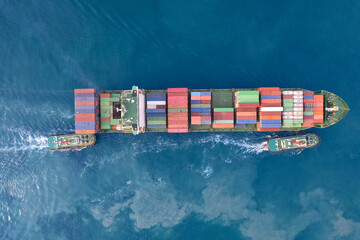 Aerial top view container ship full load container for logistics import export, shipping or transportation . shipyard at sunrise, logistic import export and transport industry background