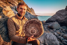 Paleontologist Holding A Beautifully Preserved Ammonite