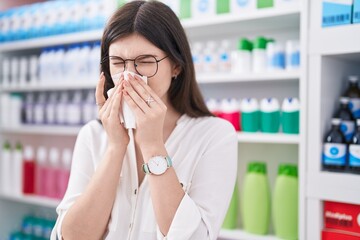 Sticker - Young caucasian woman customer using nakpin at pharmacy