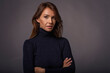 © sepy - Studio portrait of a beautiful middle-aged woman looking at the camera against isolated background