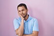 © Krakenimages.com - Hispanic man standing over pink background thinking looking tired and bored with depression problems with crossed arms.