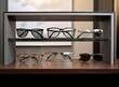 © pvl0707 - Display rack full of sunglasses. created with Generative AI technology.