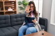 © Krakenimages.com - Young brunette woman working at consultation office doing stop sing with palm of the hand. warning expression with negative and serious gesture on the face.