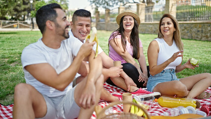 Sticker - Group of people having healthy picnic sitting on grass at park