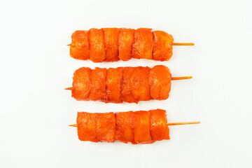 Wall Mural - Raw marinated chicken fillet skewers on a white background.Marinated Fresh.Closeup of chicken meat.Procurement for designers.Chicken breast Fillets.