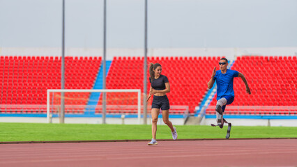 Wall Mural - Asian female trainer, male athlete with prosthetics jog together, warming up before speed run at stadium