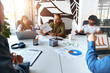 © Valerii Apetroaiei - Successful hipster team in coworking. Freelancers.