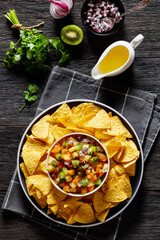 Canvas Print - summer fruit salsa with tortilla chips on plate