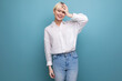 © Ivan Traimak - young pretty smart blond female student dressed in a white blouse. people lifestyle concept