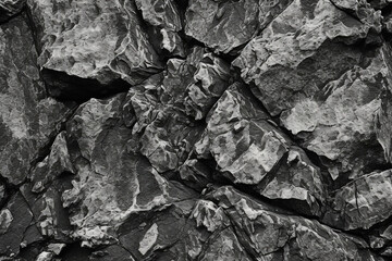 Poster - Rough texture of dark stone, embodying the rugged essence of mountain surfaces