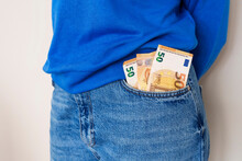 Woman With Paper Currency In Jeans Pocket