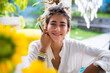 © Westend61 - Smiling artist with paintbrush at home