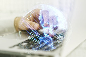 Double exposure of graphic America map and hand typing on computer keyboard on background, big data and digital technology concept