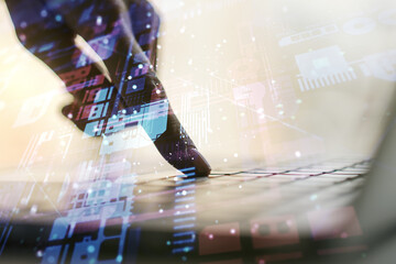 Double exposure of abstract creative programming illustration and hands typing on laptop on background, big data and blockchain concept
