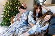 © Westend61 - Happy family having fun together at home at Christmas time
