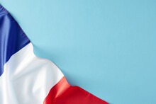 Celebration Concept For France's Bastille Day Holiday. Top View Flat Lay Of French Flag On Pastel Blue Background With Empty Space For Advert Or Message