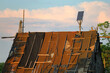 Photovoltaics instalation on a old destroyed, devastated roof