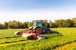 © Johnér - Tractor mowing grass in meadow