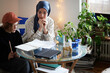 © Johnér - Mother wearing hijab helping son doing homework
