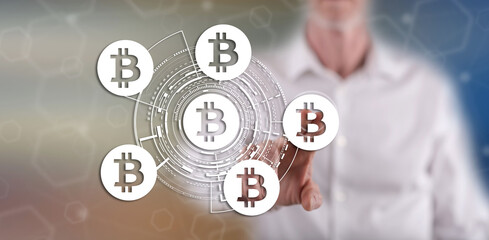 Wall Mural - Man touching a bitcoin concept