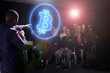 © Johnér - Bitcoin crypto currency expert giving speech to audience