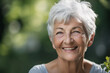 © Creative Clicks - Beautiful 60s mid aged mature woman looking at camera. Mature old lady close up portrait on a blurry background