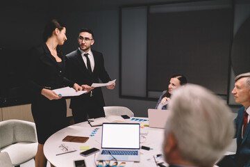 Sticker - Businesspeople discussing business plan during meeting in office