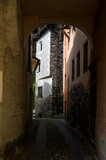 Fototapeta Uliczki - Narrow street in typical alpine village, Valle Maggia, Ticino, Switzerland.
