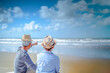 © Day Of Victory Stu. - Plan life insurance of happy retirement concepts. Senior couple sitting on chairs at the beach looking the ocean on a good day in sunny day morning.