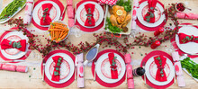 Overhead View Of Placesettings And Food On Christmas Dinner Table