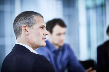 attentive businessman listening in meeting