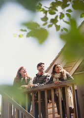 Canvas Print - Smiling friends on sunny cabin deck