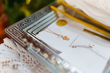 Poster - a golden cross on a chain of the ritual of baptism in the Orthodox Church. 