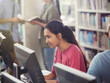 © KOTO - Focused female college student researching using computer in library