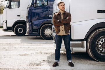 Wall Mural - Truck driver standing by his lorry