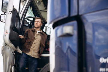 Wall Mural - Truck driver standing by his lorry