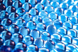 Macro of blue gel balls. Watery polymer hydrogel background. Crystal liquid. Transparent texture